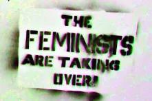 "Feminists are taking over" sprayed on a utility box